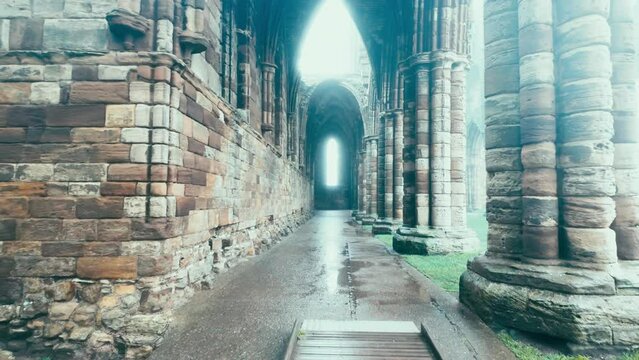 Foggy winters scene of the famous landmark Whitby Abby now derelict and formally a Benedictine abbey and is situated overlooking the sea on the East coast of England