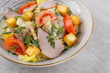 salad with ham and halloumi cheese on a stone background studio food photo 12