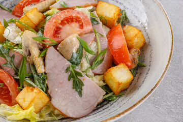salad with ham and halloumi cheese on a stone background studio food photo 13