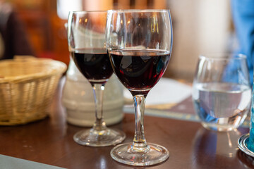 Red dry wine in glasses, lunch with wine in France,  Limouges, France