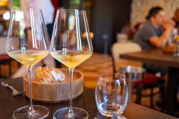 Tasting of Bordeaux white wine in Sauternes, left bank of Gironde Estuary, France. Glasses of white sweet French wine.