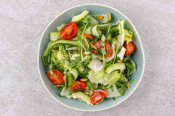 fitness salad with cherry tomatoes on a stone background studio food photo 4