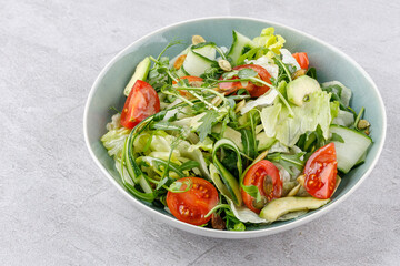 fitness salad with cherry tomatoes on a stone background studio food photo 2