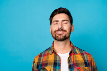 Photo of good mood man with beard dressed checkered shirt close eyes focused on positive thoughts...