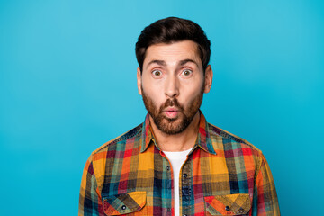 Fototapeta premium Photo of astonished speechless man with beard dressed plaid shirt staring at unbelievable discount isolated on blue color background