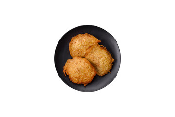 Delicious crispy pancakes made from potatoes, meat, carrots, onions
