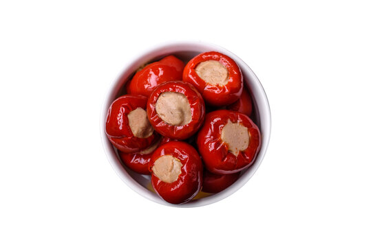 Red bell peppers stuffed with cheese or meat with salt, spices and herbs - Powered by Adobe