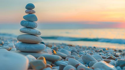 Fotobehang Zen stones balanced perfectly against a serene beach sunset © pier