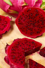 Red dragon fruit Set with appetizing serving on green background. Top view