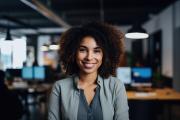 Fototapeta premium Portrait of a young female professional in modern office space