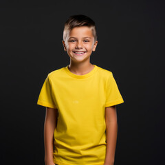 Smiling boy wearing yellow T-Shirt Mockup on black studio background. Generative Ai
