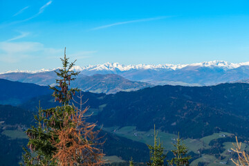 Panoramic view of snow capped mountain ridges of Woelzer Tauern seen from Grebenzen, Gurktal Alps,...