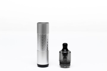 Opened vaping device, vape, pod, kit silver color on white background, side view