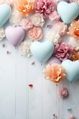 soft hearts and flowers on a light wooden background.