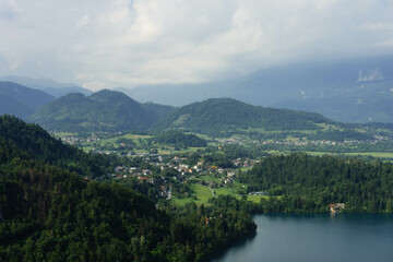 Fototapeta na wymiar top view of gorgeous clear water blue lake and mountains around in slovenia