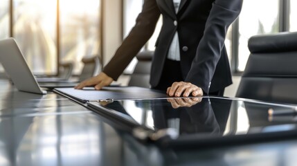 A sharply dressed businessman effortlessly navigates his laptop's touch screen, seamlessly merging technology and fashion in a modern indoor setting