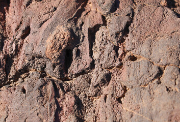 Red volcanic rock texture close up