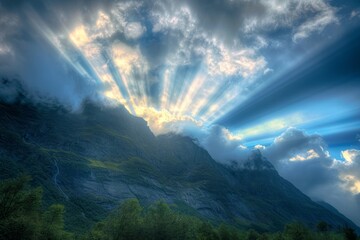 Rays of light piercing through clouds above a rugged mountain, illustrating divine intervention.