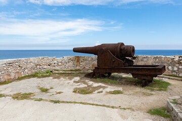 Cannon near rampart of Castillo de los Tres Reyes del Morro castle in Havana, Cuba