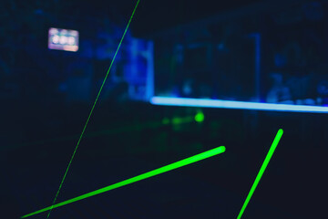 Laser tag play arena with fluorescent paint