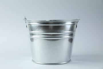 One shiny metal bucket on white background