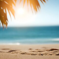 A sandy beach with the ocean in the background and palm leaves at the top under bright sunlight.