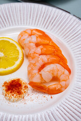 Catch of the day, fresh cooked shrimps served with lemon and garlic sauce in seafood restaurant