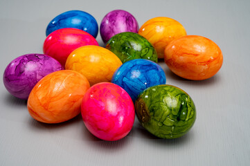 Colorful Easter eggs on table for celebration of catholic Easter in april, close up