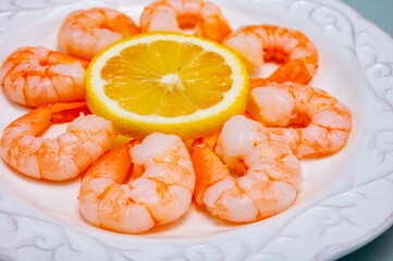 Catch of the day, fresh cooked shrimps served with lemon and garlic sauce in seafood restaurant