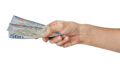 Hand-holding Saudi banknotes isolated on a white background.