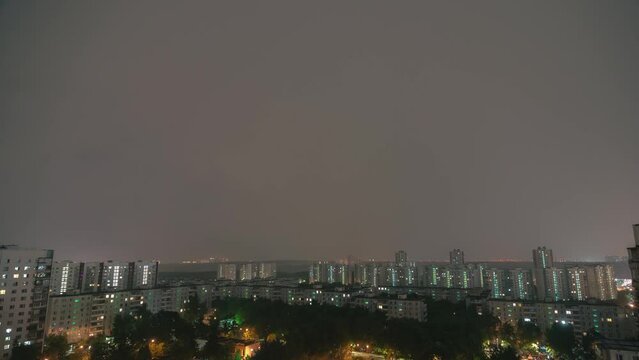 Timelapse of night thunderstorm in the city