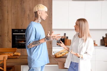 Young couple quarreling in kitchen