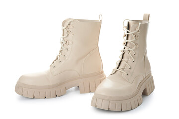 Stylish leather boots on white background