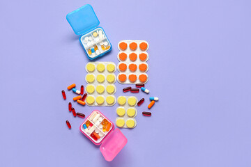 Composition with different pills on lilac background