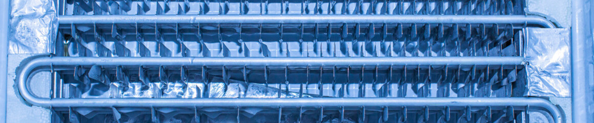 Fototapeta premium close-up of the insides of a home refrigerator during cleaning and repair service at an official diagnostic center