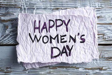 two color background white and light purple with handwriiten "HAPPY WOMEN'S DAY"