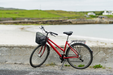 Fototapeta na wymiar Bike parked on Inishmore, the largest of the Aran Islands in Galway Bay. Renting a bicycle is one of the most popular way to get around Inis Mor, Ireland.