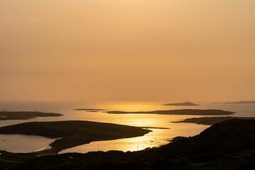 Obraz premium Sunset view of Ardmore and Turbot islands from famous scenic Sky Road, 15km looped drive starting in Clifden with numerous brilliant viewing points, Wild Atlantic Way, Connemara, Ireland.