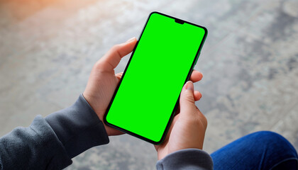 Mockup image of a business people holding smart mobile phone with blank green screen - obrazy, fototapety, plakaty