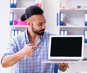 Young designer working in his studio on new project