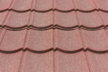 Texture of stone coated steel roof tiles in red color