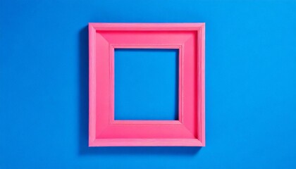 A pink empty frame isolated on the vibrant blue background. Decorative detail, retro inspired backdrop