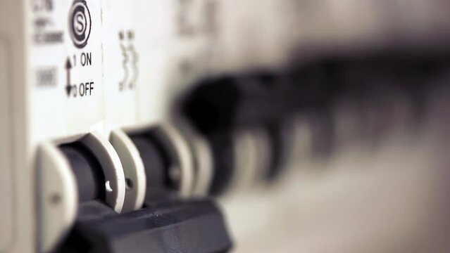 Hand Turning Off Home Electrical Breaker, Buenos Aires Argentina - Close Up - 4K