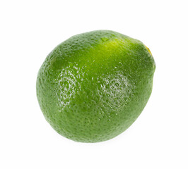 One whole fresh lime with water drops isolated on white