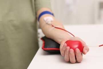 Patient undergoing blood transfusion in hospital, closeup