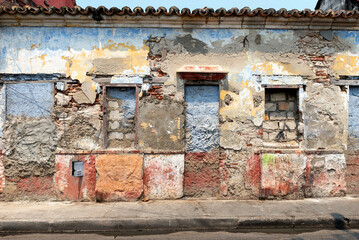 Colourful facade of house with windows and doors covered