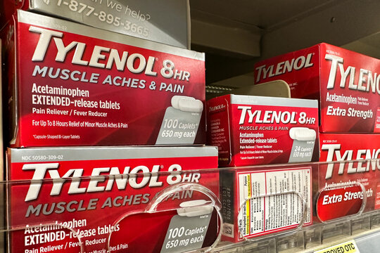 Miami, Florida - Boxes of Tylenol 8 HR for muscle aches and pain relief neatly arranged on the shelves of a Walgreens retail pharmacy store.