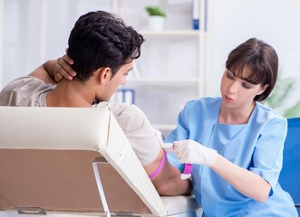 Patient getting blood transfusion in hospital clinic
