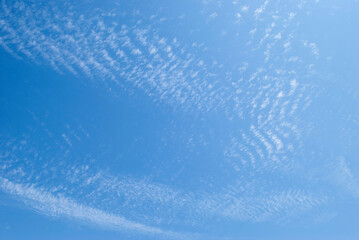 gentle white clouds in the blue sky