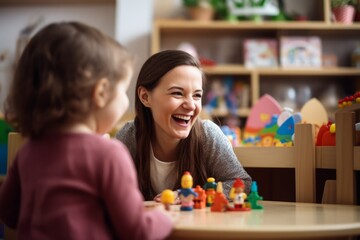A warm-hearted woman speech therapist in her inviting office, filled with learning aids, assisting children with speech difficulties